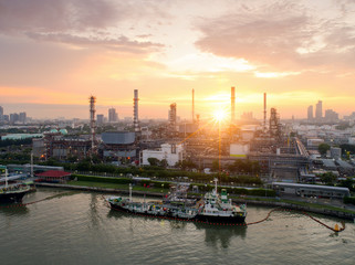 Fototapeta premium Aerial view of twilight of oil refinery ,Shot from drone of Oil refinery and Petrochemical plant at dusk , Bangkok, Thailand