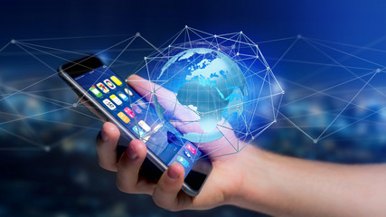 Businessman using smartphone with a Connected network over a earth globe concept on a futuristic interface - 3d rendering