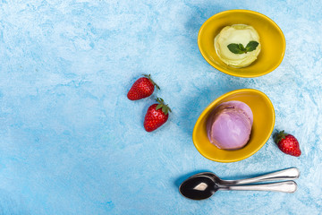 Colorful fruit  ice cream balls on blue background