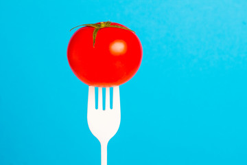 tomato fresh vegetable bright fork art background
