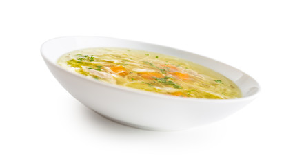 Chocken or beef soup with noodles carrot and parsley herb isolated on white