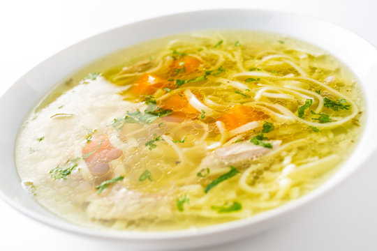 Chicken or beef soup with noodles carrot and parsley herb