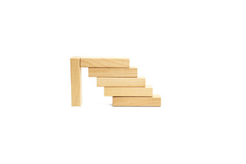 Naklejka na ściany i meble Wooden blocks stairs isolated on white background.