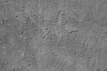 gray concrete uneven cracked background.