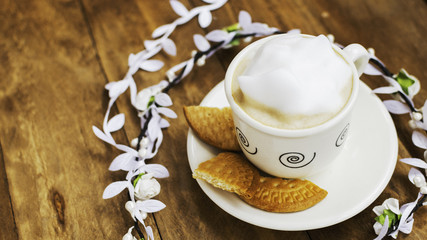 Cup of coffee with milk and foam.