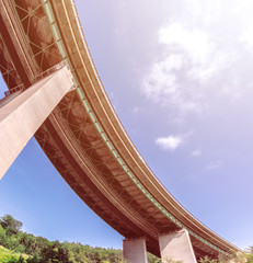 Bending highway bridge, autostrada curve, bottom view