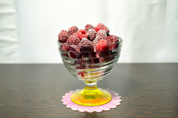 frozen strawberry with raspberries in a glass