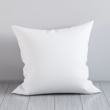 Blank white soft square pillow on a wooden floor near the wall, 3D render