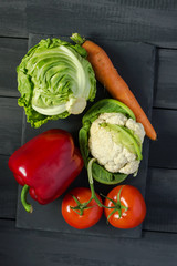 Fresh vegetables on stone cutting board. Copy space. Natural, organic products.