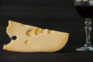 Glass of red wine with cheese. Romantic dinner with red wine.