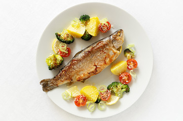 fried fish and vegetables sprinkled with cheese