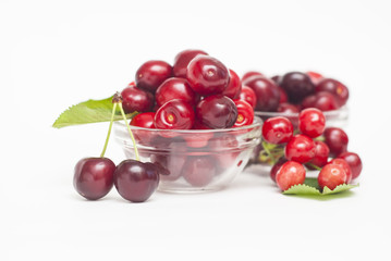 Cherries. Cherry. Cherries in color bowl and kitchen napkin. Red cherry. Fresh cherries. Cherry on white background. healthy food concept