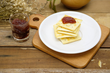 delicious crackers topping with strawberry jam