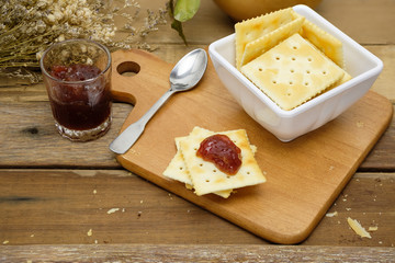 delicious saltine crackers spread with strawberry jam