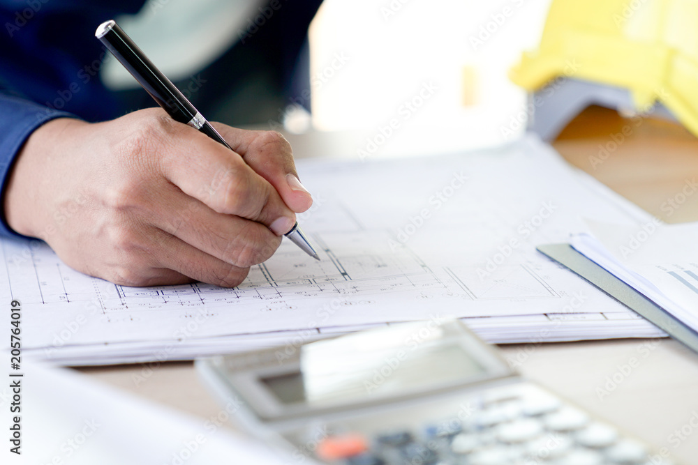 Poster flat lay of top view desk work table architect with drawing home plan building and stationary in hom