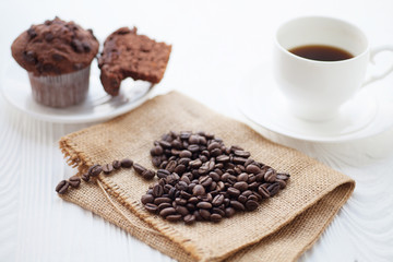 Cup of coffee with chocolate muffins.