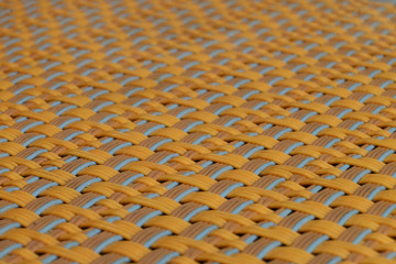 Perspective view of luxury weaving pattern of mat in orange theme color