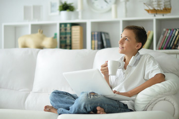 boy using  modern laptop