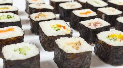 Traditional sushi set on a white background close up.