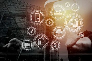 businessman wearing virtual reality goggles in modern office with mobile phone using with VR headset with London city exposure