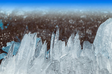 Melting dangerous ice on the river.Sharp aquamarine ice crystals and ice chips float on the surface of the water.
