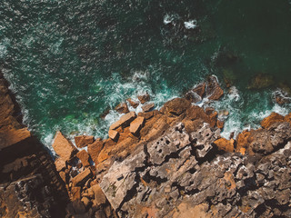 Aerial view of ocean waves and fantastic Rocky coast