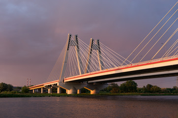 Cable stayed bridge, Krakow, Poland, during sunset over Vistula river