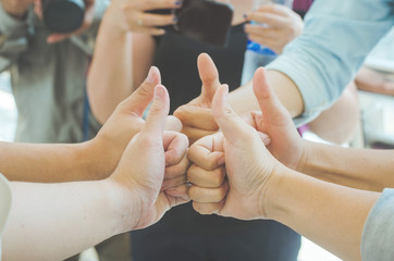 teamwork concept of diversity multiethnic people with group hands bump for relationship and together. give fist bump with thumb up to start up together concept.