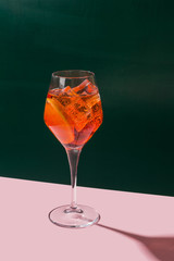 Spritz Veneziano, IBA cocktail in a calix on a table, pop graphic style