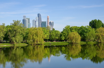 The spring view on the Great Novodevichy Pond with modern Moscow-city buildings on the background, Moscow, Russia