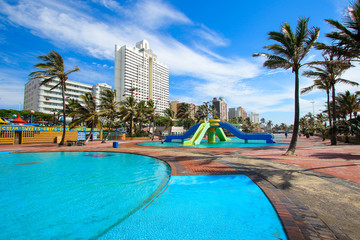 Public pools on the red paved promenade of Durban's "Golden Mile" beachfront, KwaZulu-Natal province of South Africa