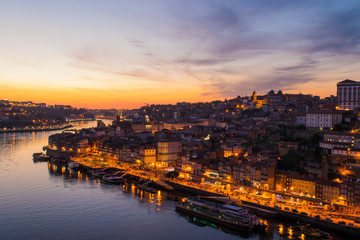 Fototapeta na wymiar Sunset over the Douro River and the city of Porto in northern Portugal