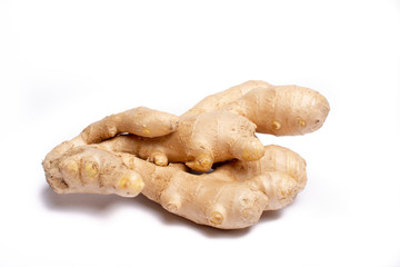 Fresh big ginger root close up copy space isolated on white background
