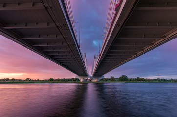 Cable stayed bridge over Vistula river, Krakow, Poland, beautiful colorful sunset