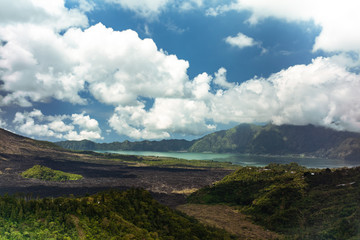 Beautiful cloudscape and landscape of lakeside and lava plain near Kintamani volcano