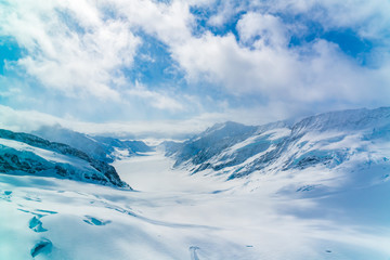 Panoramic view of the snowy Alps Mountain with the famous Aletsch Glacier