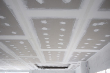 ceiling gypsum board installation at construction site