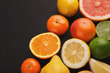 Heap of citruses on white wood, copy space