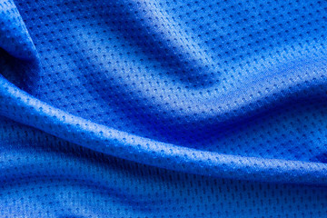 Blue color fabric sport clothing football jersey with air mesh texture background