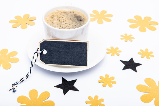 Happy Father's Day Background. Cup of coffee and black bow tie on white background. Floral Fathers day still life setup.