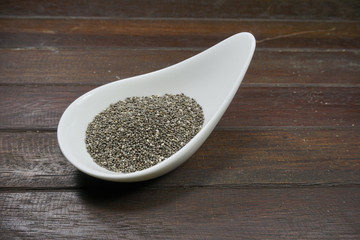 Chia seed, a healthy food  on a wooden background