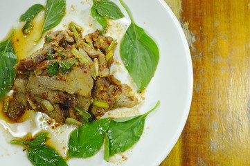 Thai spicy slice barbecue pork salad on plate