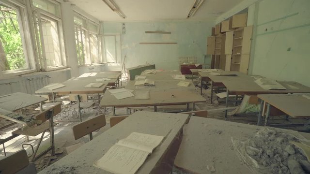 Classroom in an abandoned school in Pripyat. Chernobyl nuclear disaster. Slider shot - Juni 2017: 30km Chernobyl, exclusion zone