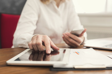 Woman hands on keyboard and tablet close up