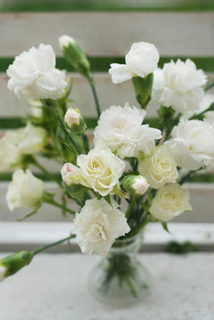 White Carnation Dianthus Flower Bouquet Bloom Summer Time. Vertical image.