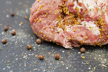 A large piece of fatty pork meat marinated with mustard, pepper and various spices