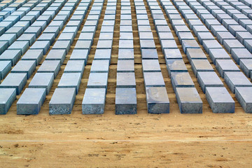 brick blocks lie in rows, tile for the sidewalk