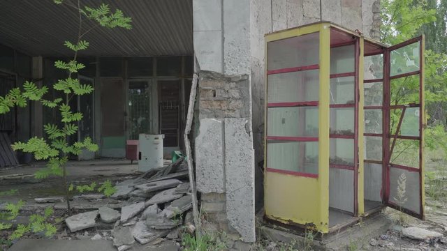 Abandoned building and call box in Pripyat. Chernobyl nuclear disaster. Slider shot - Juni 2017: 30km Chernobyl, exclusion zone