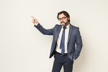 Businessman pointing something on white background