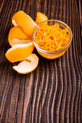 oranges and juice on a wooden background